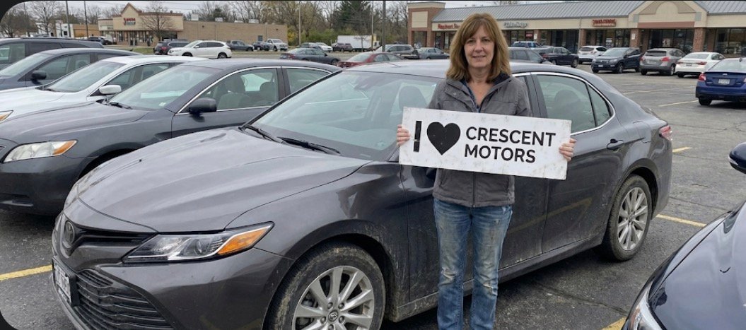 Happy seller with Ford Explorer at Crescent Motors DFW